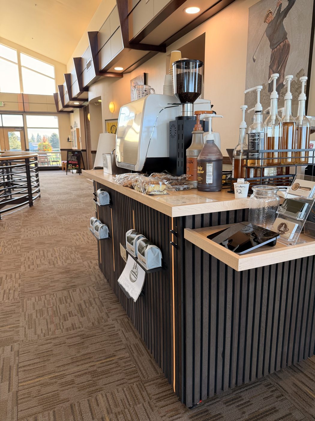 The cart: espresso machine, syrups, pastries on the counter